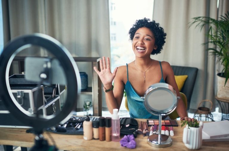 Shot of a influencer recording a makeup tutorial for her blog at home